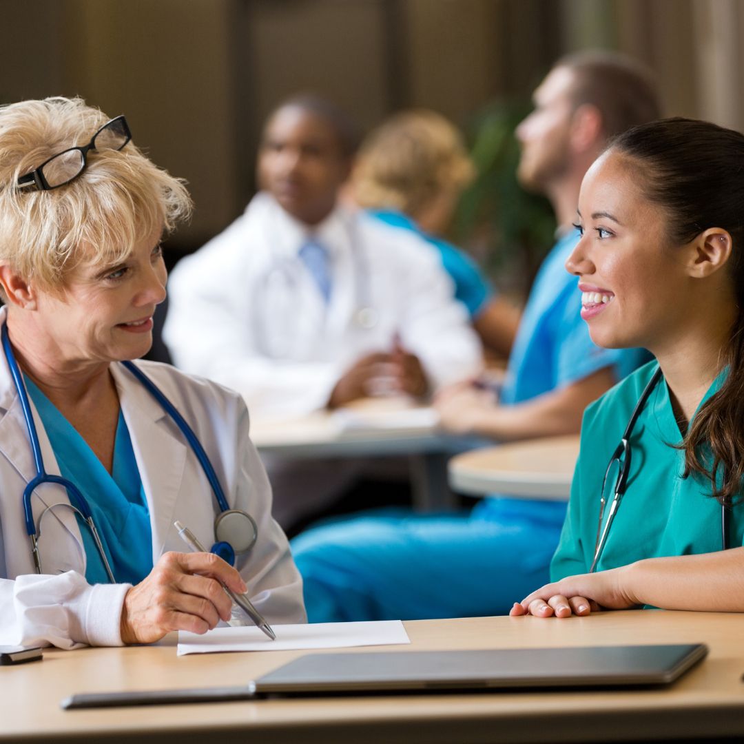 nurse talking with doctor