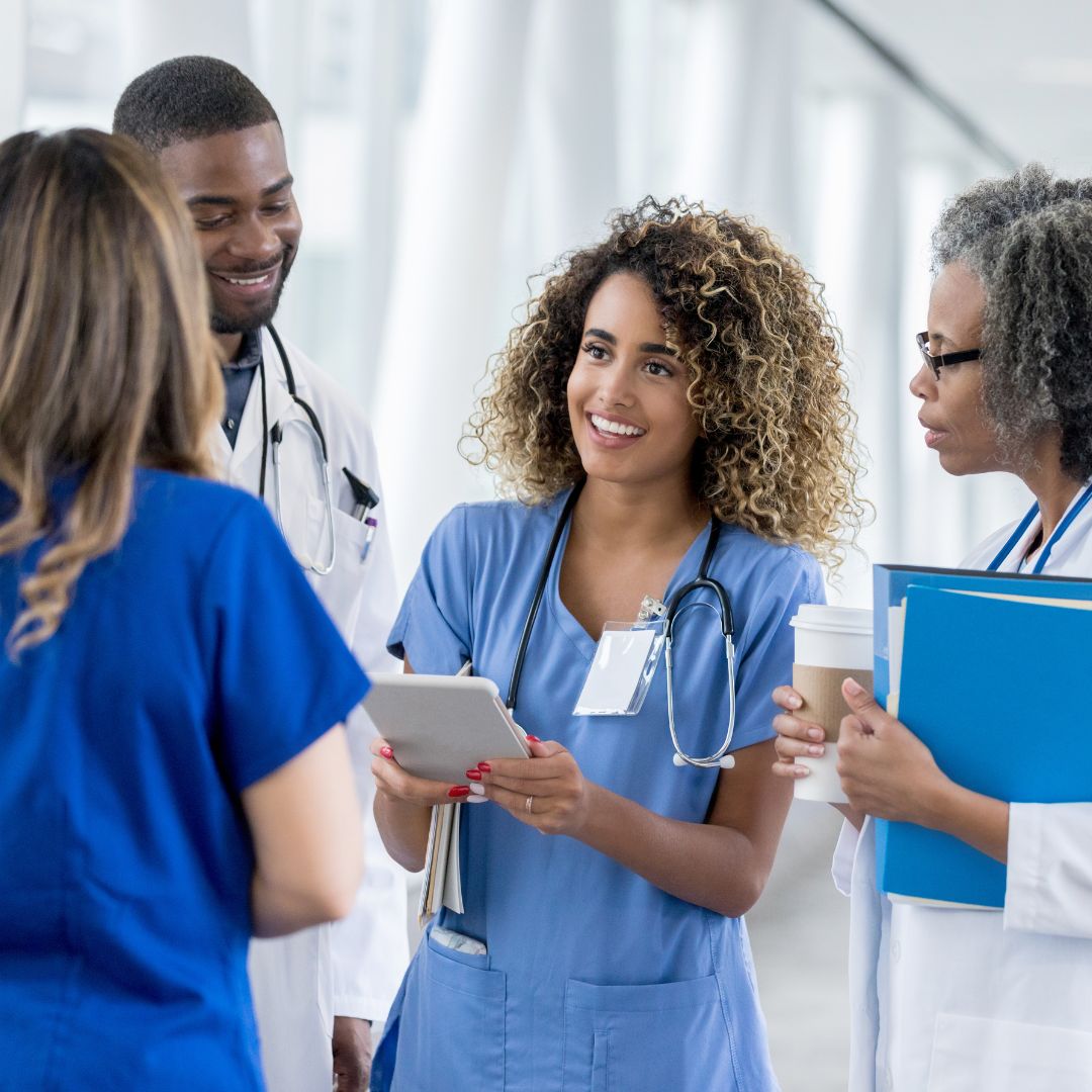 nurses talking in a group